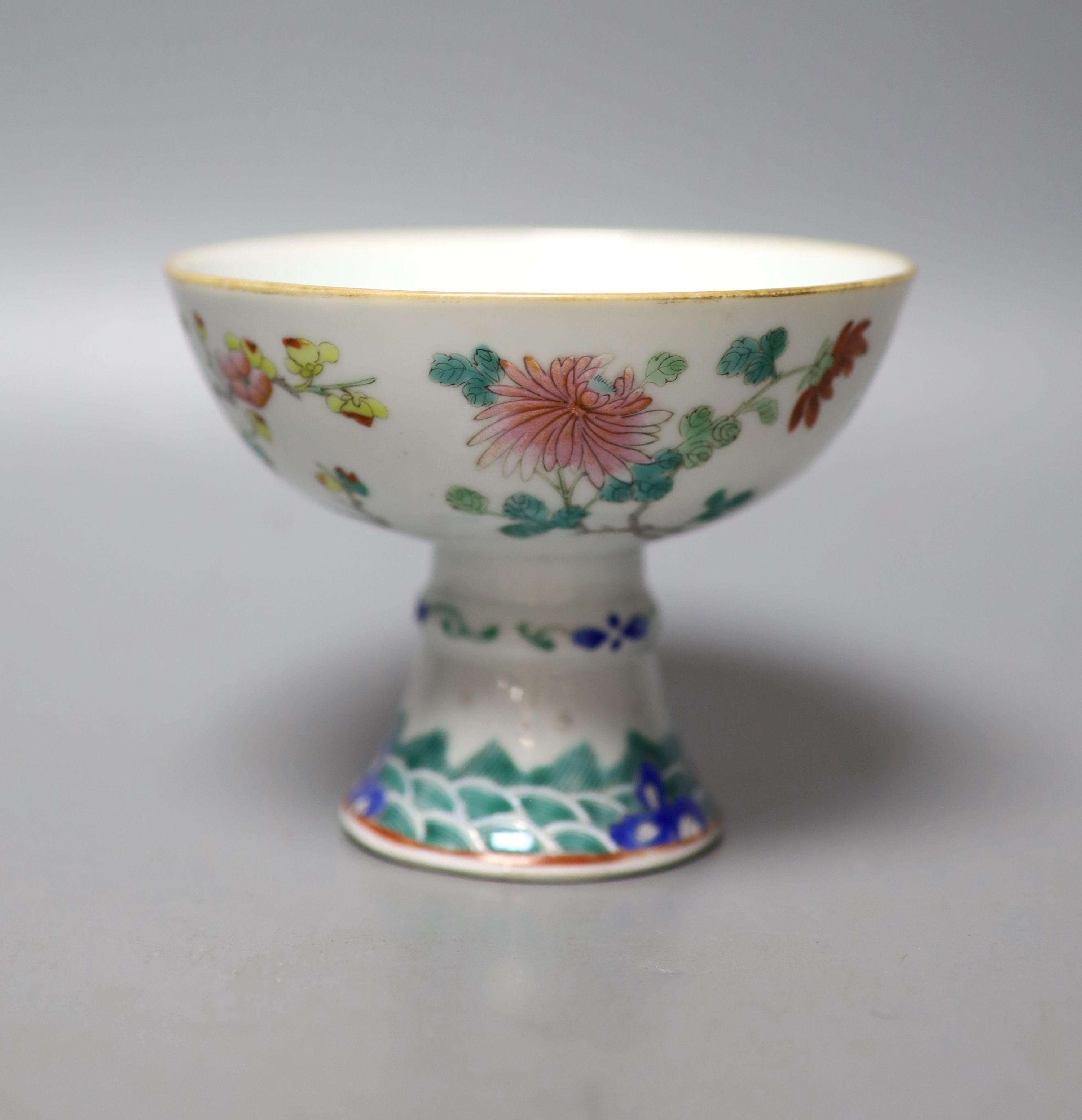 A 19th century Chinese famille stem cup, 12cm diameter